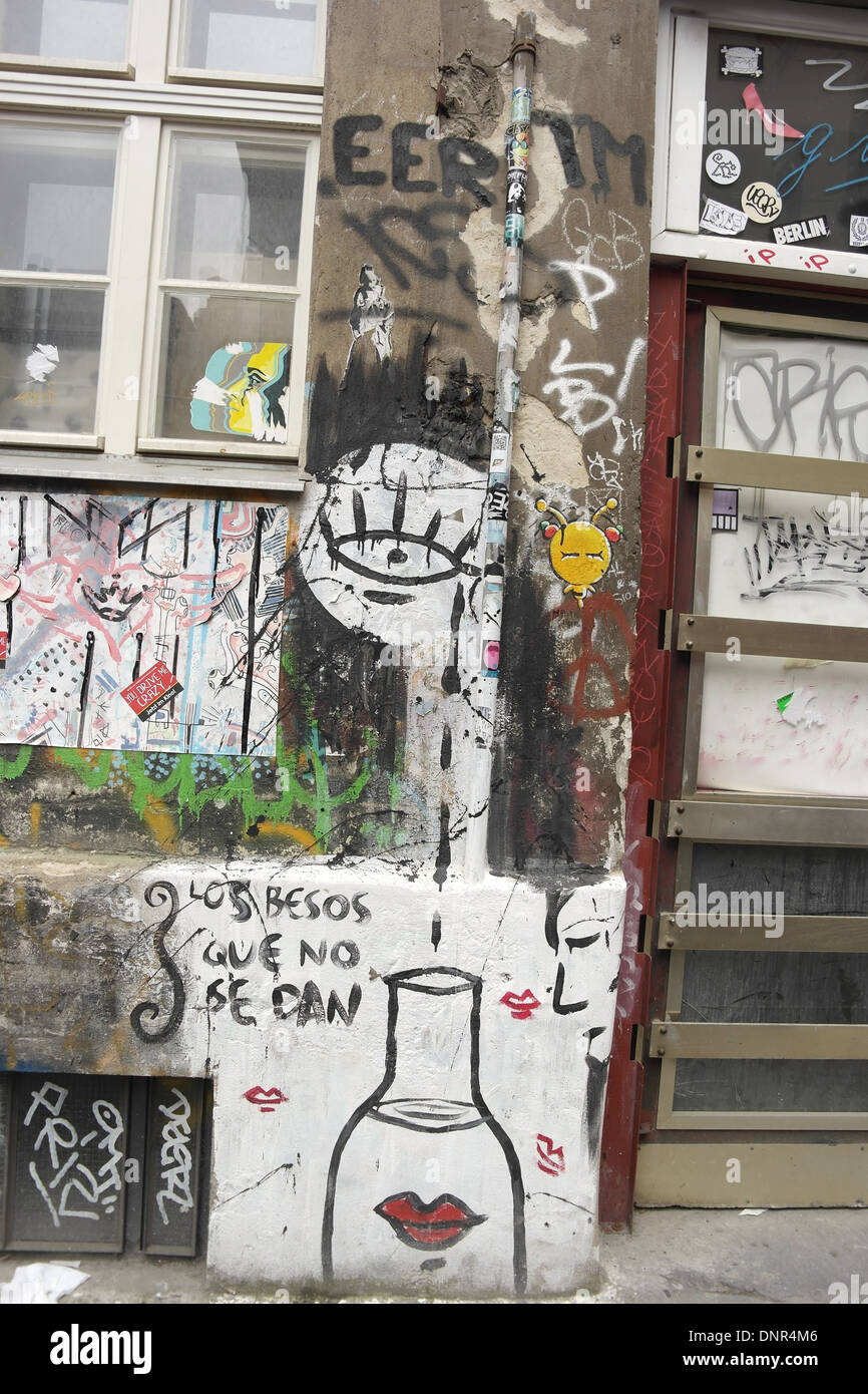 Portrait graffiti scrawl, eye weeping red lips bottle, grey plaster wall, Cafe Cinema, Rosenthaler Strasse 39, Berlin Stock Photo