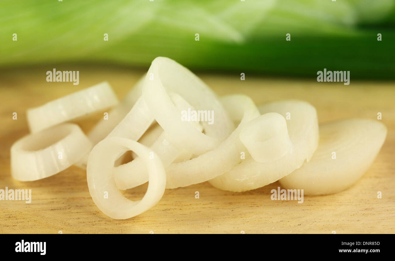 raw-white-onion-rings-on-wooden-surface-stock-photo-alamy