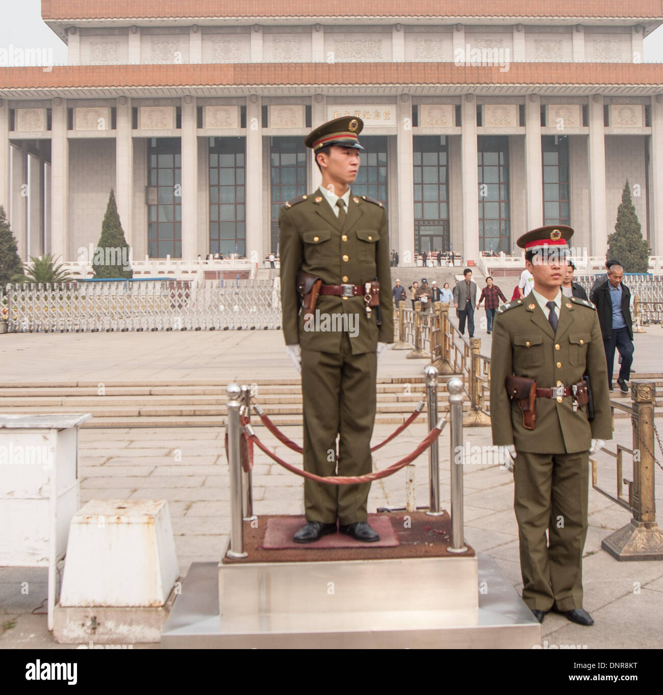 Beijing, China. 16th Oct, 2006. A pair of soldiers of the Chinese People's Liberation Army (PLA) stand guard by a heroic sculpture depicting workers, peasants and soldiers near the entrance to the Chairman Mao Memorial Hall, commonly known as the Mausoleum of Mao Zedong, his the final resting place. This highly popular attraction is located in Tiananmen Square in Beijing, the capital of the Peoples Republic of China © Arnold Drapkin/ZUMAPRESS.com/Alamy Live News Stock Photo