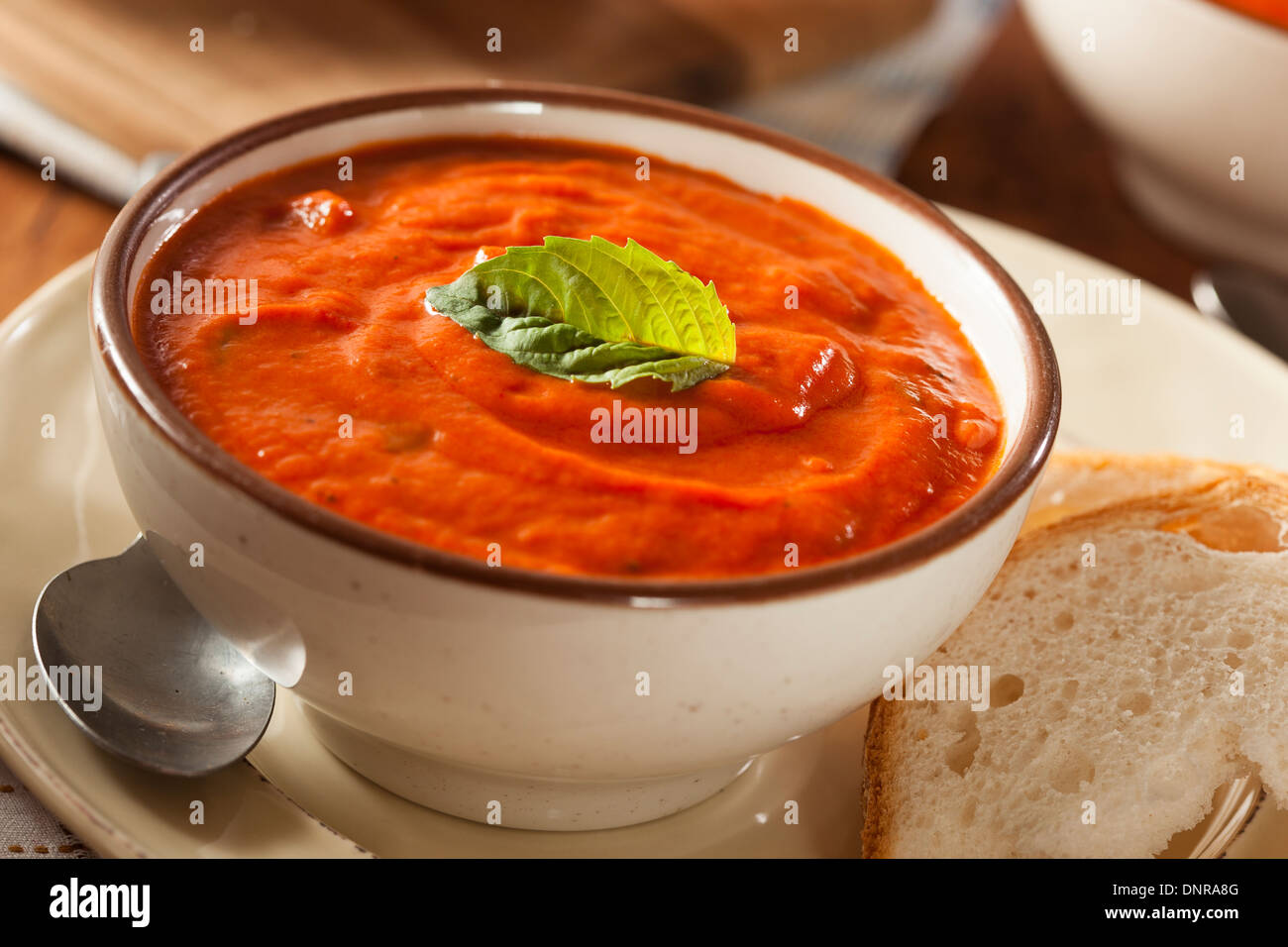 Creamy Tomato Basil Bisque Soup with Bread Stock Photo Alamy