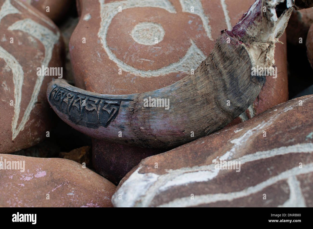 Yak Horn with a Mantra inscribed on it. Stock Photo