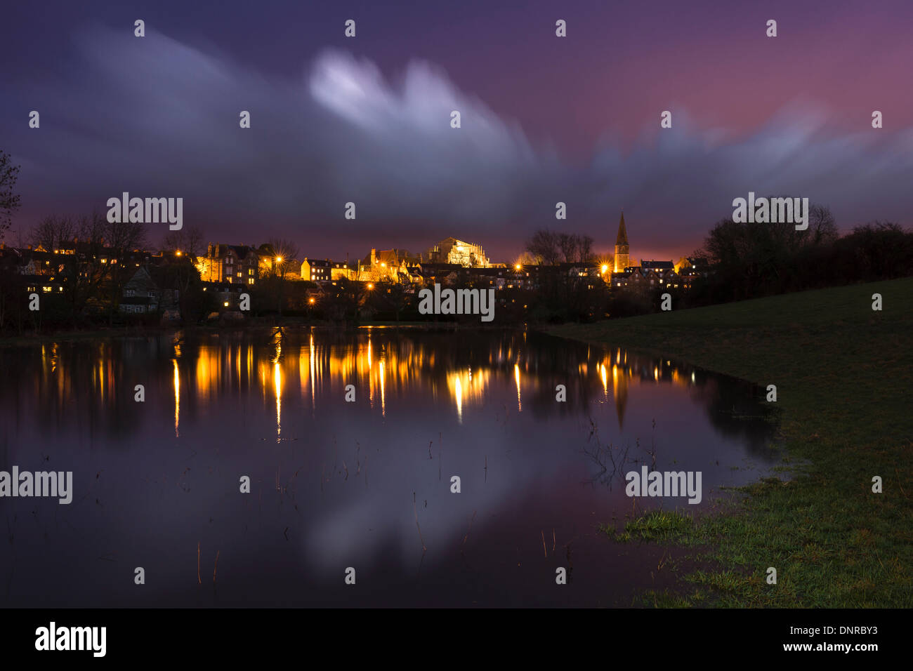 Malmesbury, Wiltshire, UK. 04th Jan, 2014. The storm clouds recede over the Wiltshire hillside town of Malmesbury, leaving the towns floodplain saturated with several feet of floodwater. The UK has been hit by yet another wave of flooding at the start of the new year. Credit:  Terry Mathews/Alamy Live News Stock Photo