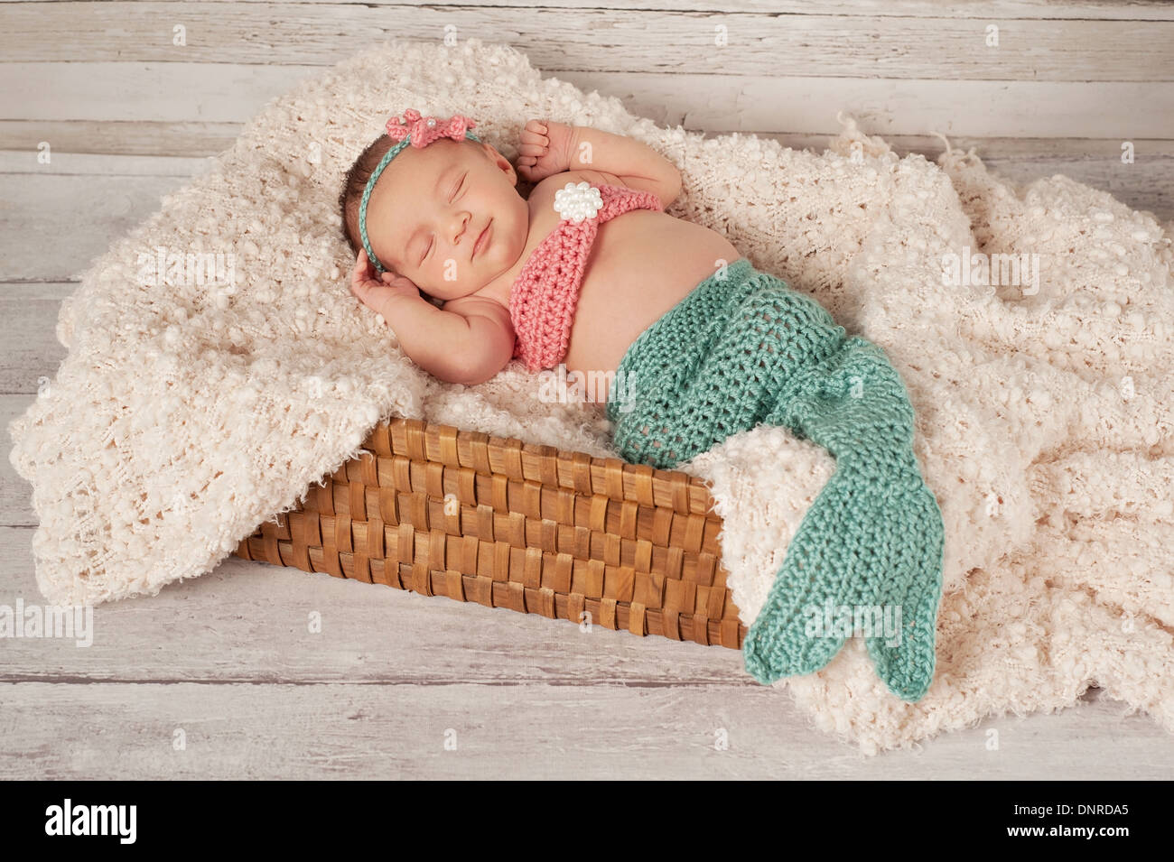 Sleeping Newborn Baby Girl Wearing a Mermaid Costume Stock Photo