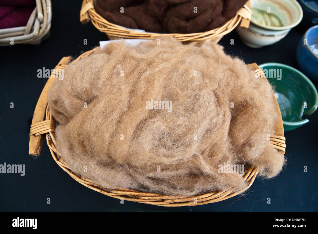 Naturally colored raw animal wool fleece. Stock Photo