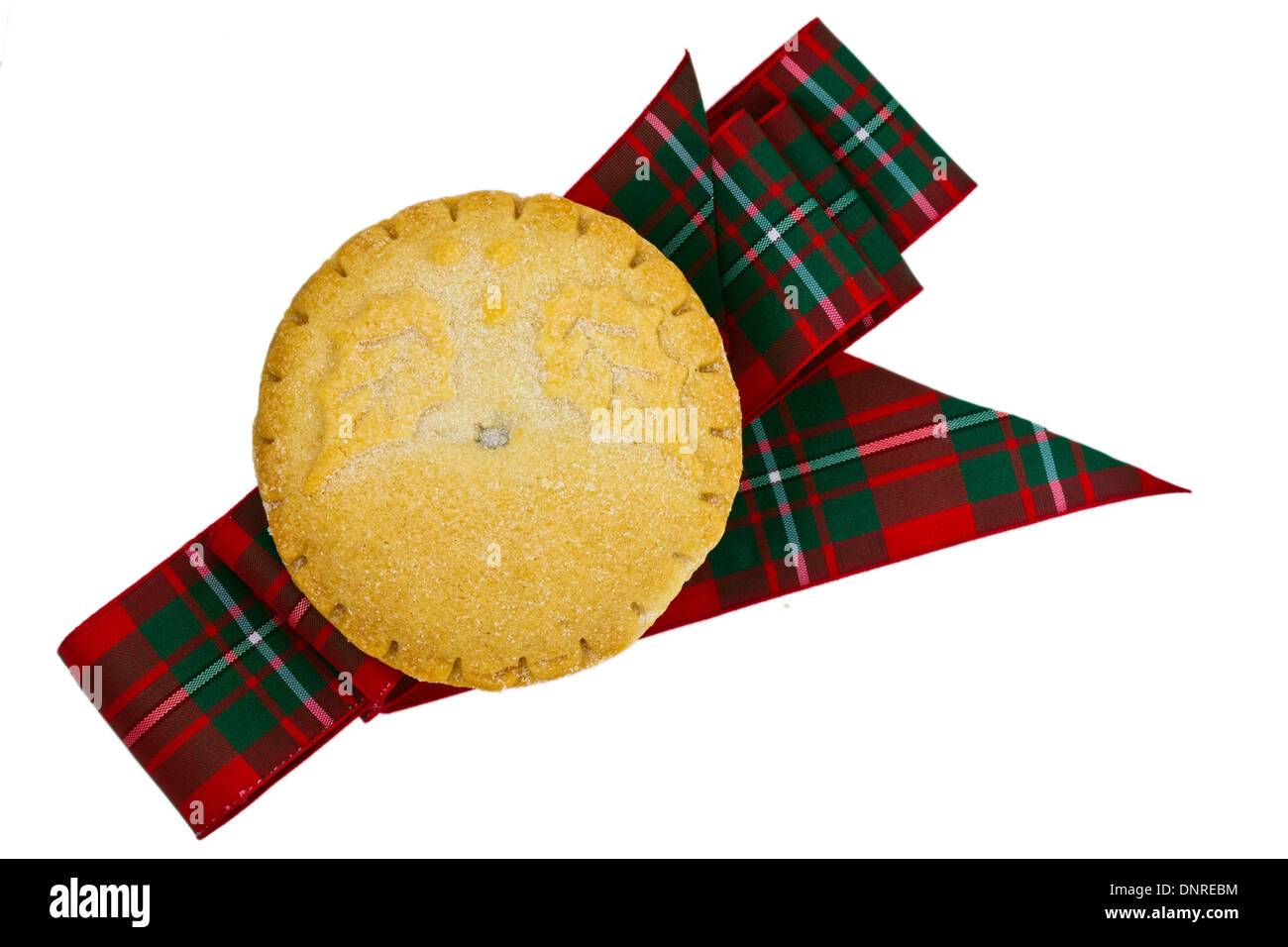 Baked mince pie and a tartan ribbon isolated on white. Stock Photo