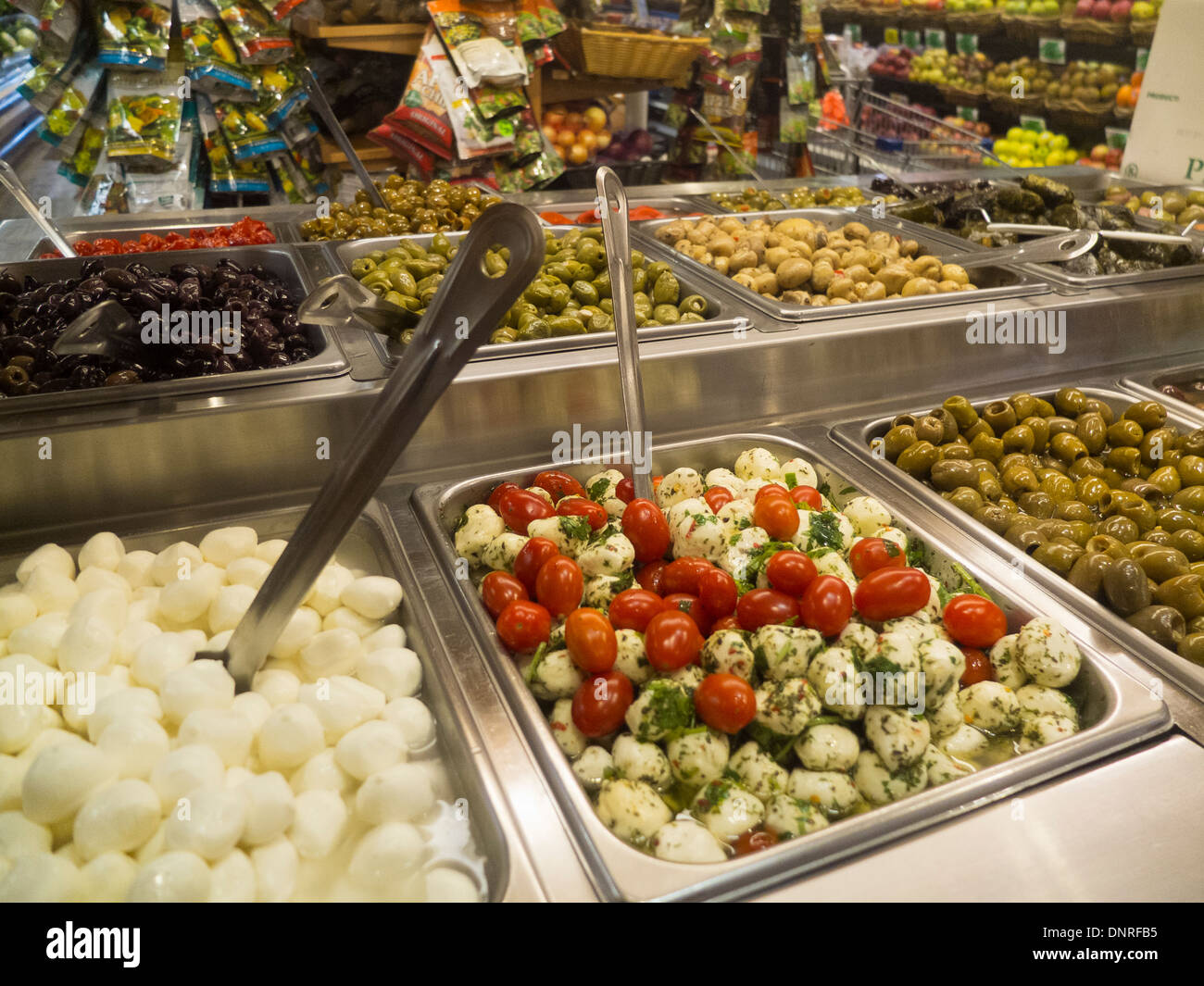 cheese and olive bar in grocery store Stock Photo Alamy