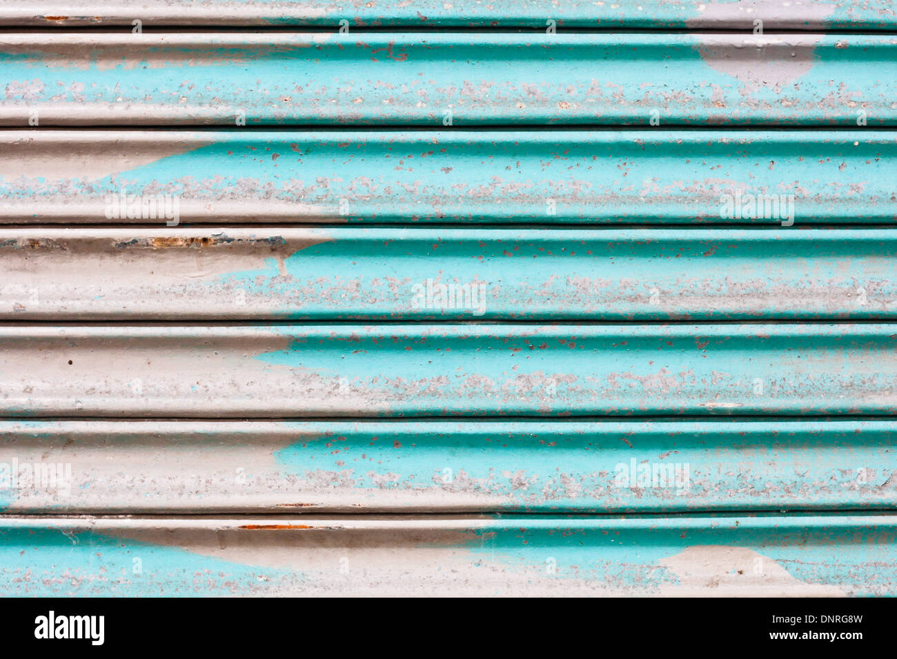 Blue rusty corrugated metal sheet as a background Stock Photo