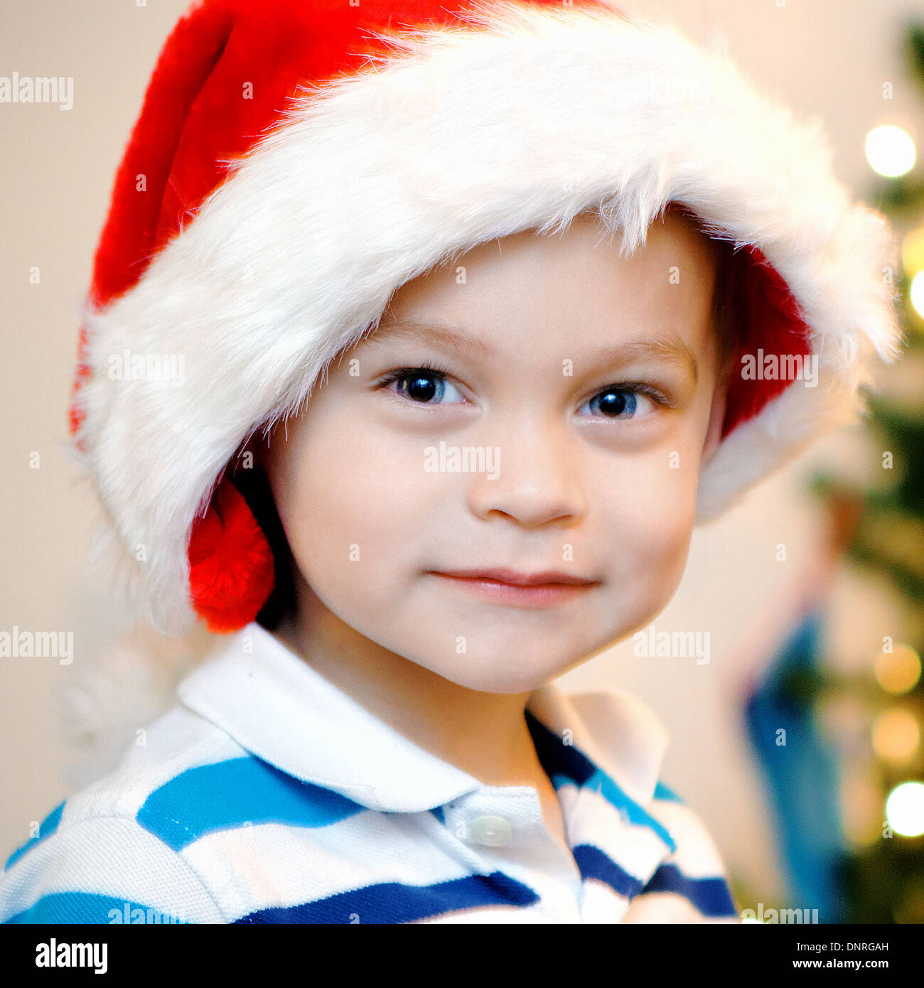 Young boy with Christmas hat Stock Photo