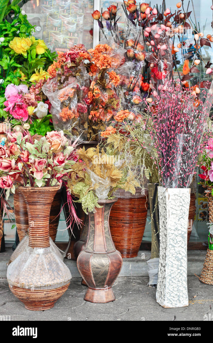 Flowers and plants in large pots at a florist shop Stock Photo