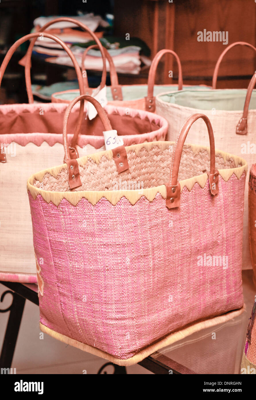 Selection of hand made shopping bags for sale at a market stall Stock