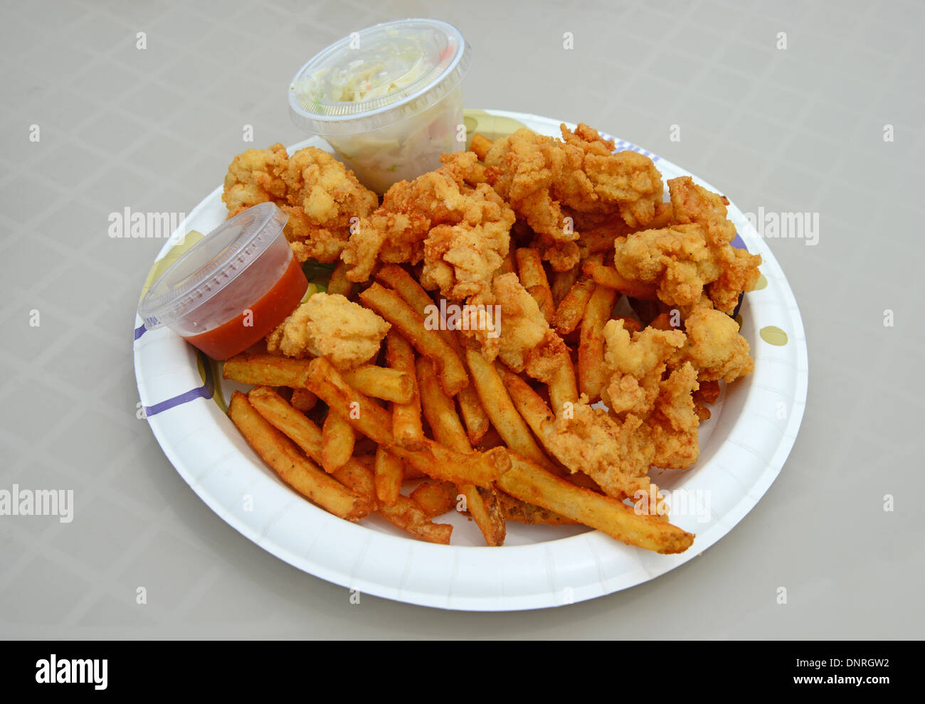 conch fritters and gator bites with french fries Stock Photo