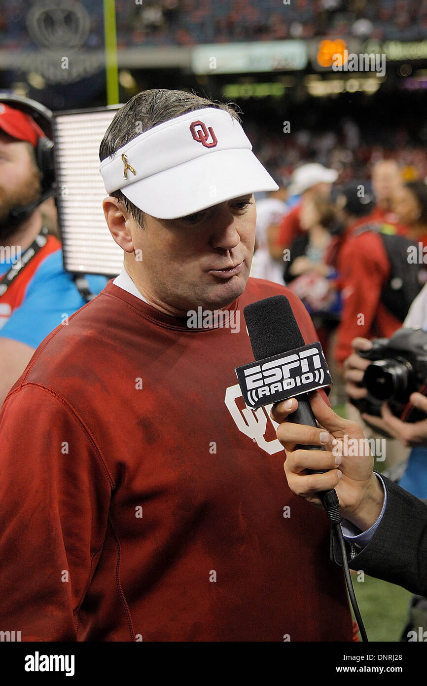 New Orleans, Louisiana, USA. 2nd Jan, 2014. Jan 02 2014 - New Orleans, LA U.S.A - Oklahoma Head Coach Bob Stoops with ESPN Raido during after game celebration Allstate Sugar Bowl game between Oklahoma University Sooners and University of Alabama Crimson Tide 45-31 win at Mercedes - Benz Superdome Louisiana, NO © csm/Alamy Live News Stock Photo