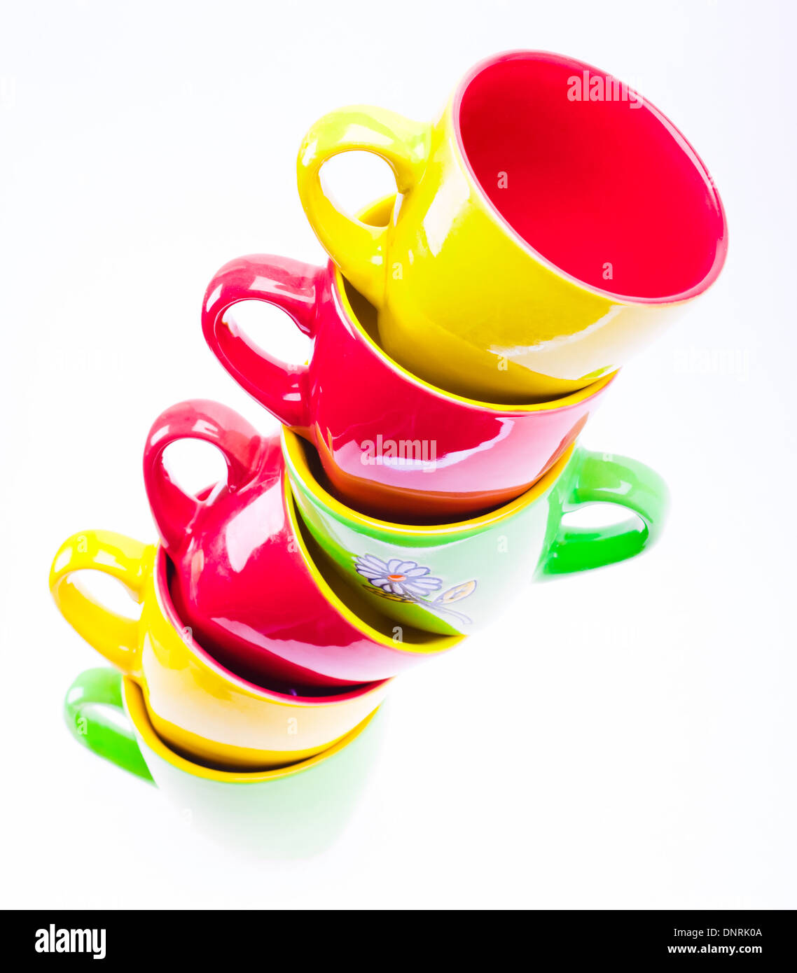Yellow, Red, Green Color Cups. Leaning Tower Stack Of Clean Different