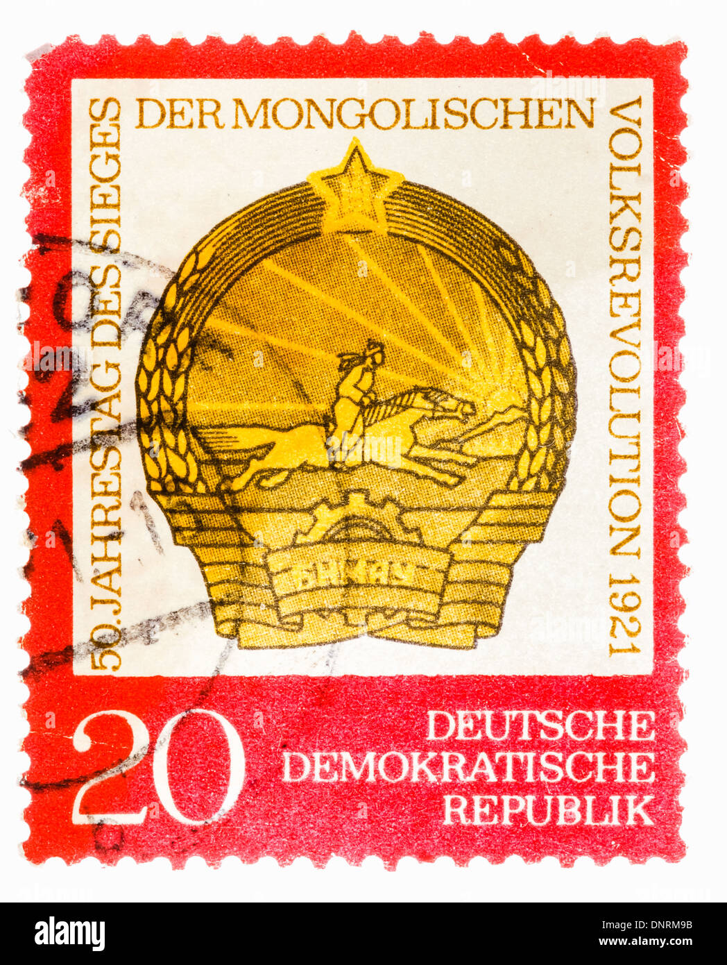 GDR - CIRCA 1971: Postage stamp printed in the GDR shows the date of the 50th anniversary of the victory of the Mongolian People Stock Photo
