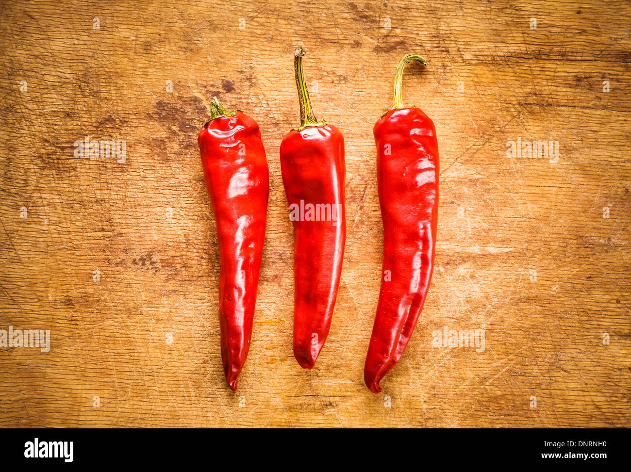Red Hot Chili Peppers On Old Wooden Table Surface Texture Background ...