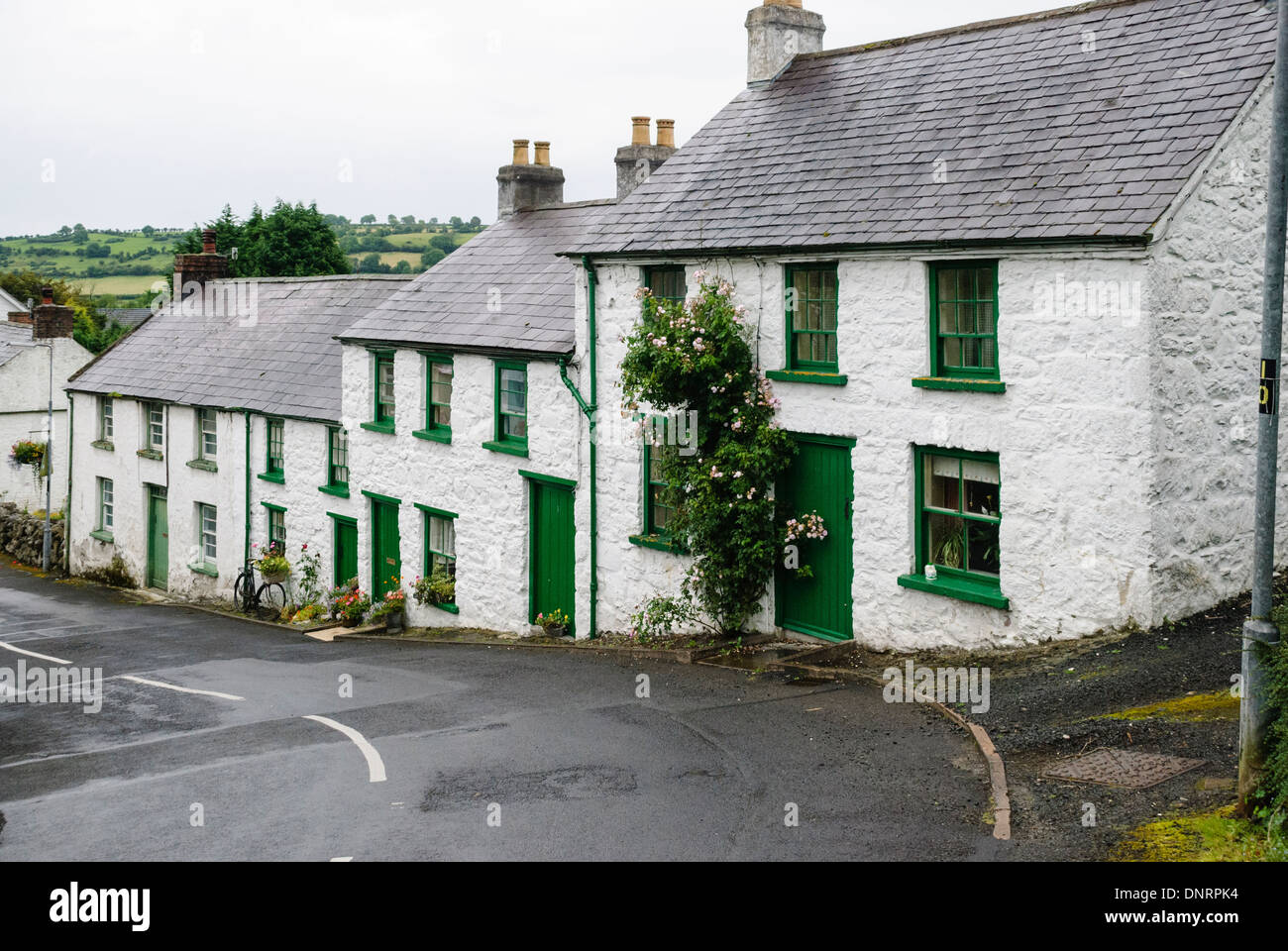 Whitewashed houses on the hill in Gleno Village, County Antrim Stock