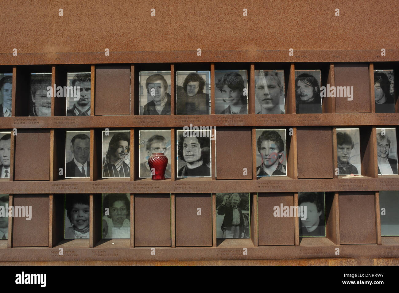 Sunny view three rows monochrome photographs 19 Berlin Wall victims