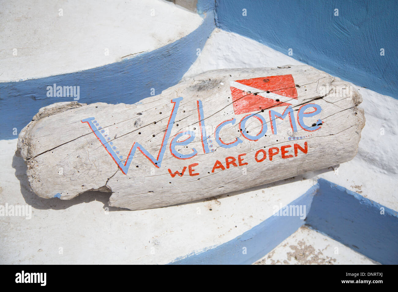 A Welcome sign outside a dive shop in the Caribbean. Stock Photo