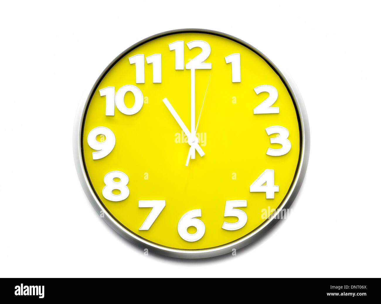 yellow clock face 11 o'clock Stock Photo