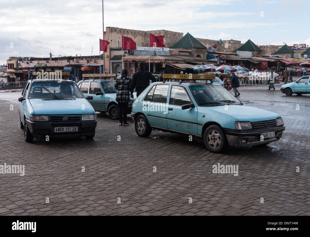 'Petit taxi' cars in Meknes, Morocco. They are privately owned and run but all the same colour - blue in Meknes Stock Photo