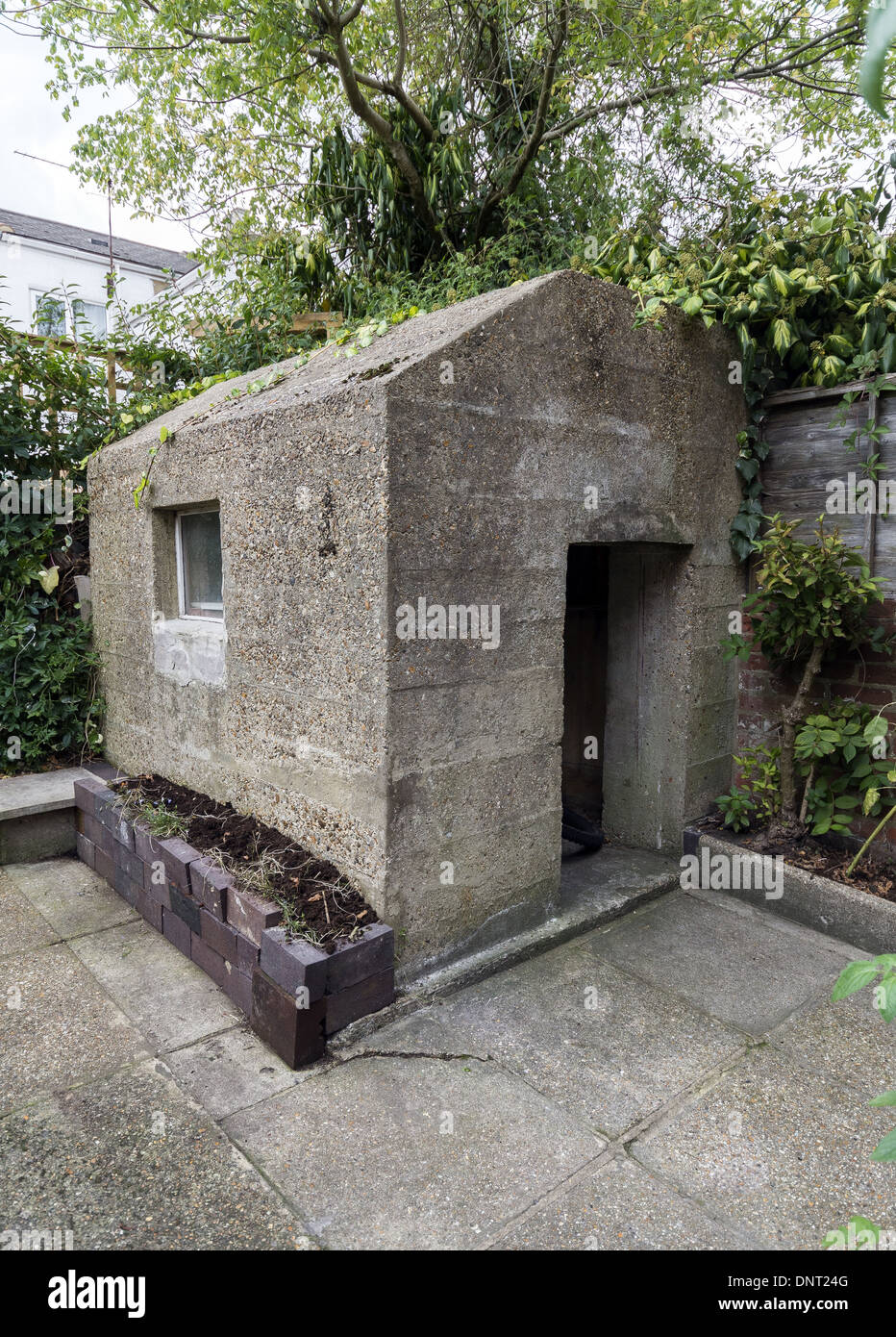 Thick concrete air raid shelter in the back garden of a Southampton
