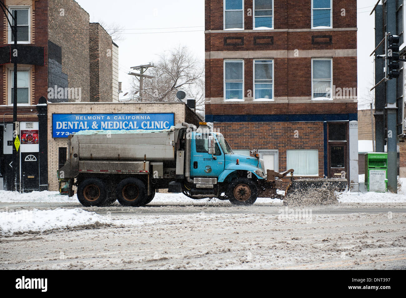 Chicago, Il, USA. 5th Jan, 2013. A city snow plow clears the streets of Chicago as heavy snowfall and rapidly dropping temperatures return on January 5, 2014. Credit: Max Herman / Alamy Live News Stock Photo