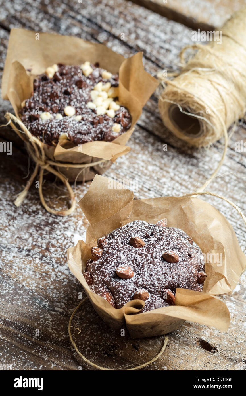 Closeup of decorating chocolate muffins with string Stock Photo - Alamy