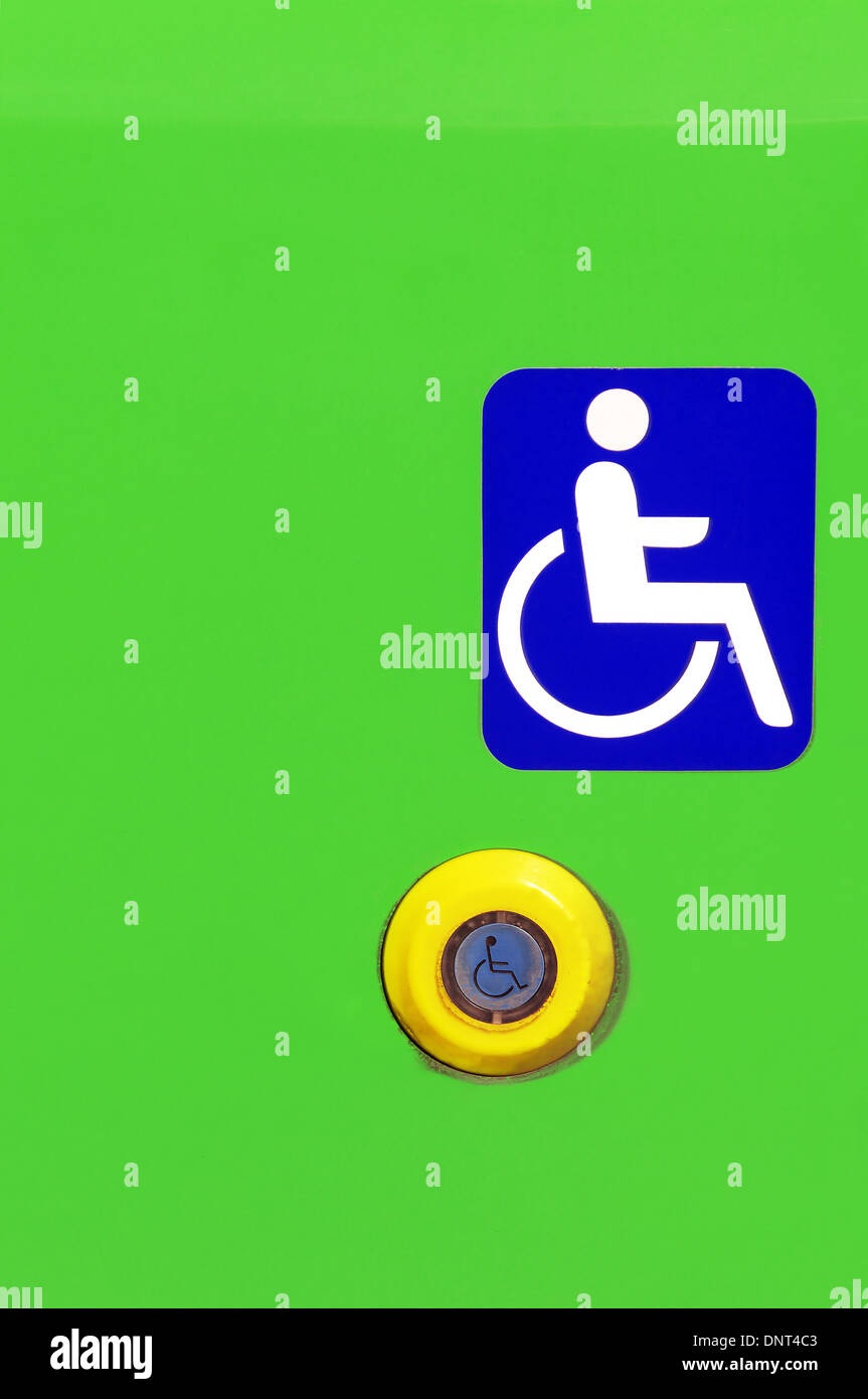 sign and button on public bus for handicapped people Stock Photo