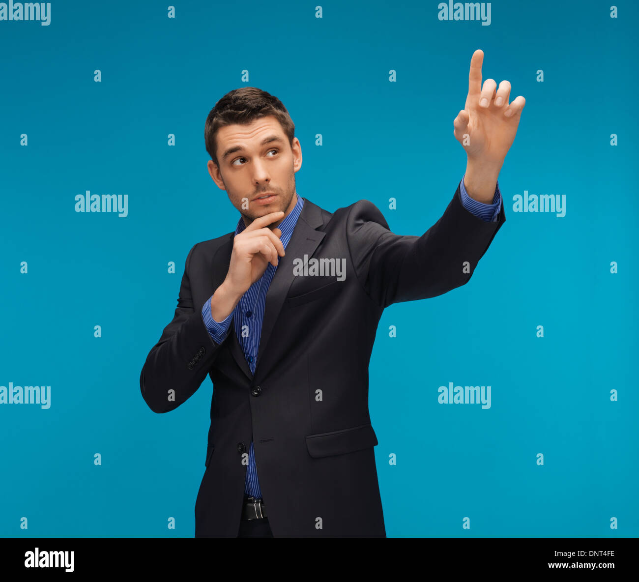 man in suit working with something imaginary Stock Photo