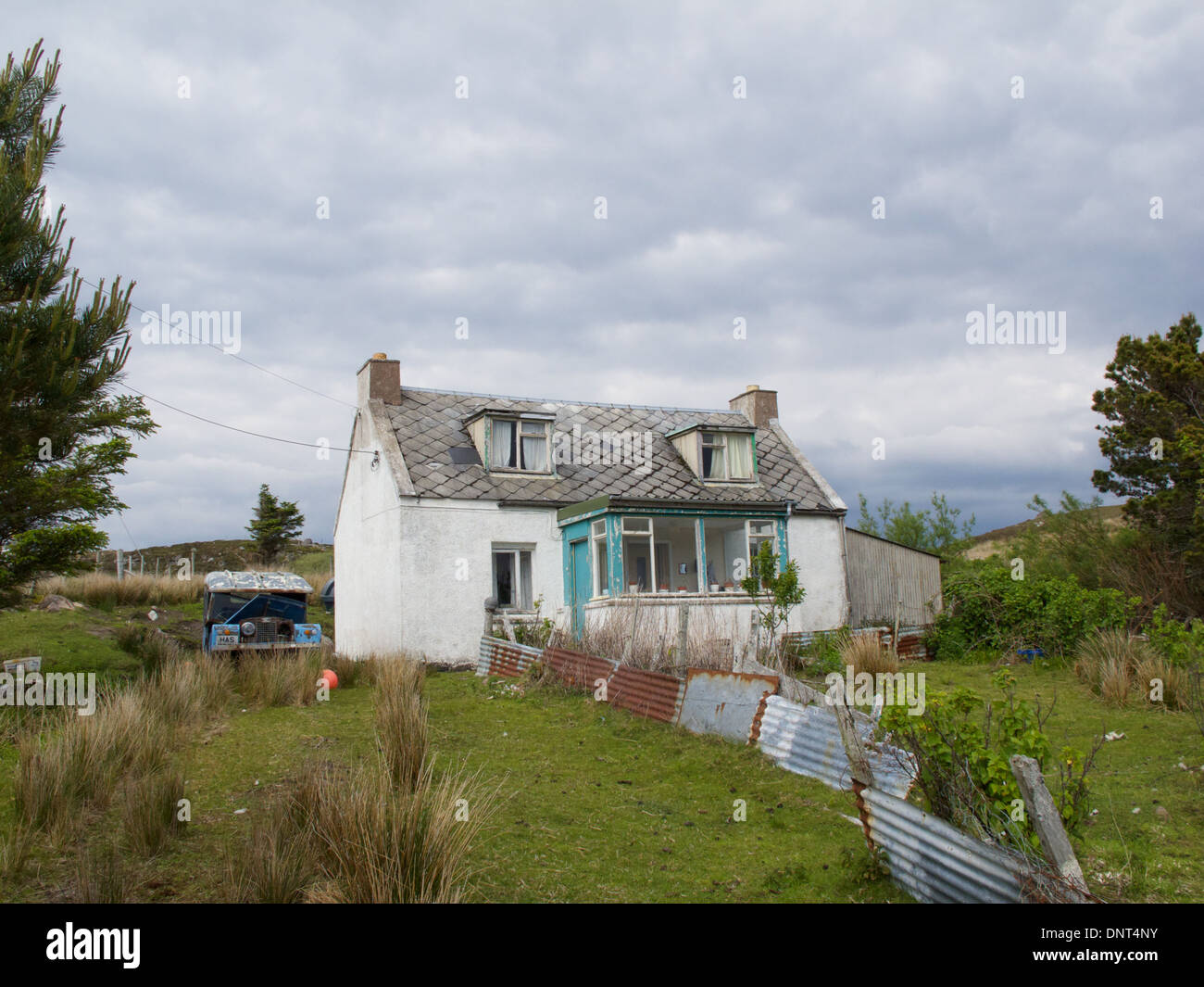 Cottage with derelict Land Rover in garden, near Redpoint, Loch