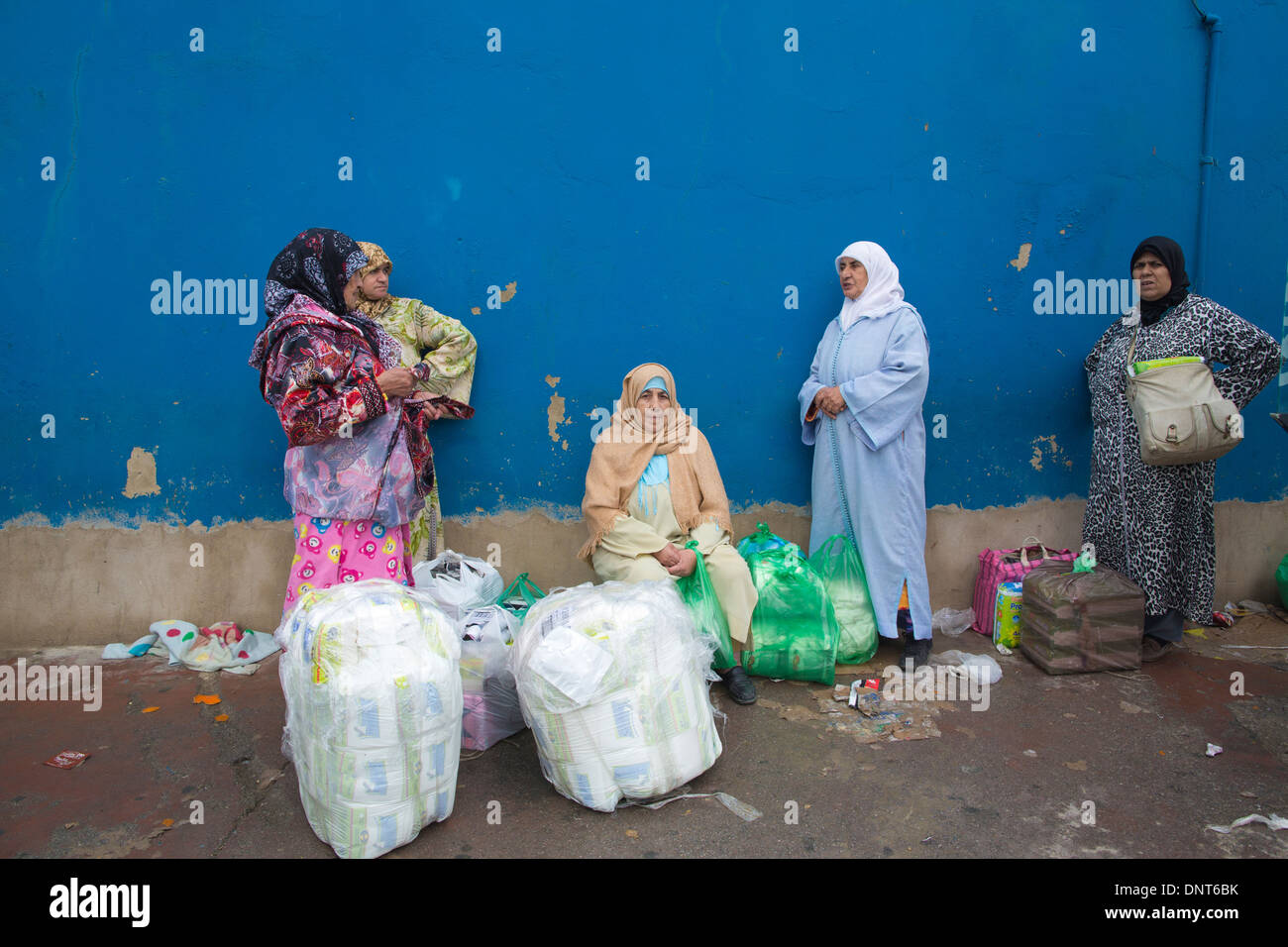 Local vendors at the Tarajal border crossing between Ceuta the Spanish province and Morocco on the north western tip of Africa. Stock Photo
