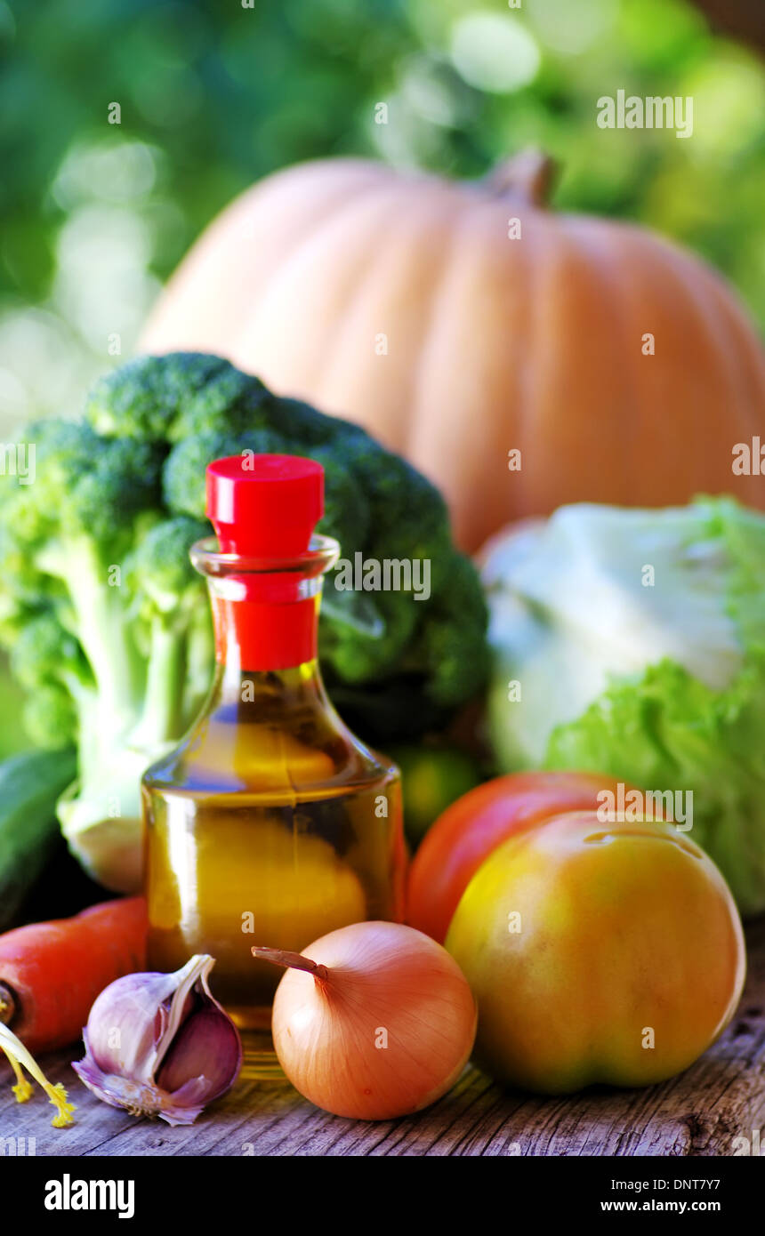 Olive oil and fresh vegetables Stock Photo Alamy