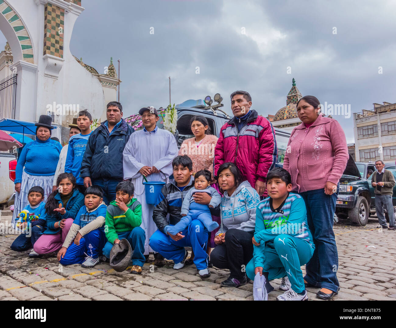 A large family grouping, at the blessing of the automobiles in front of the Basilica of Our Lady of Copacabana, Bolivia. Stock Photo