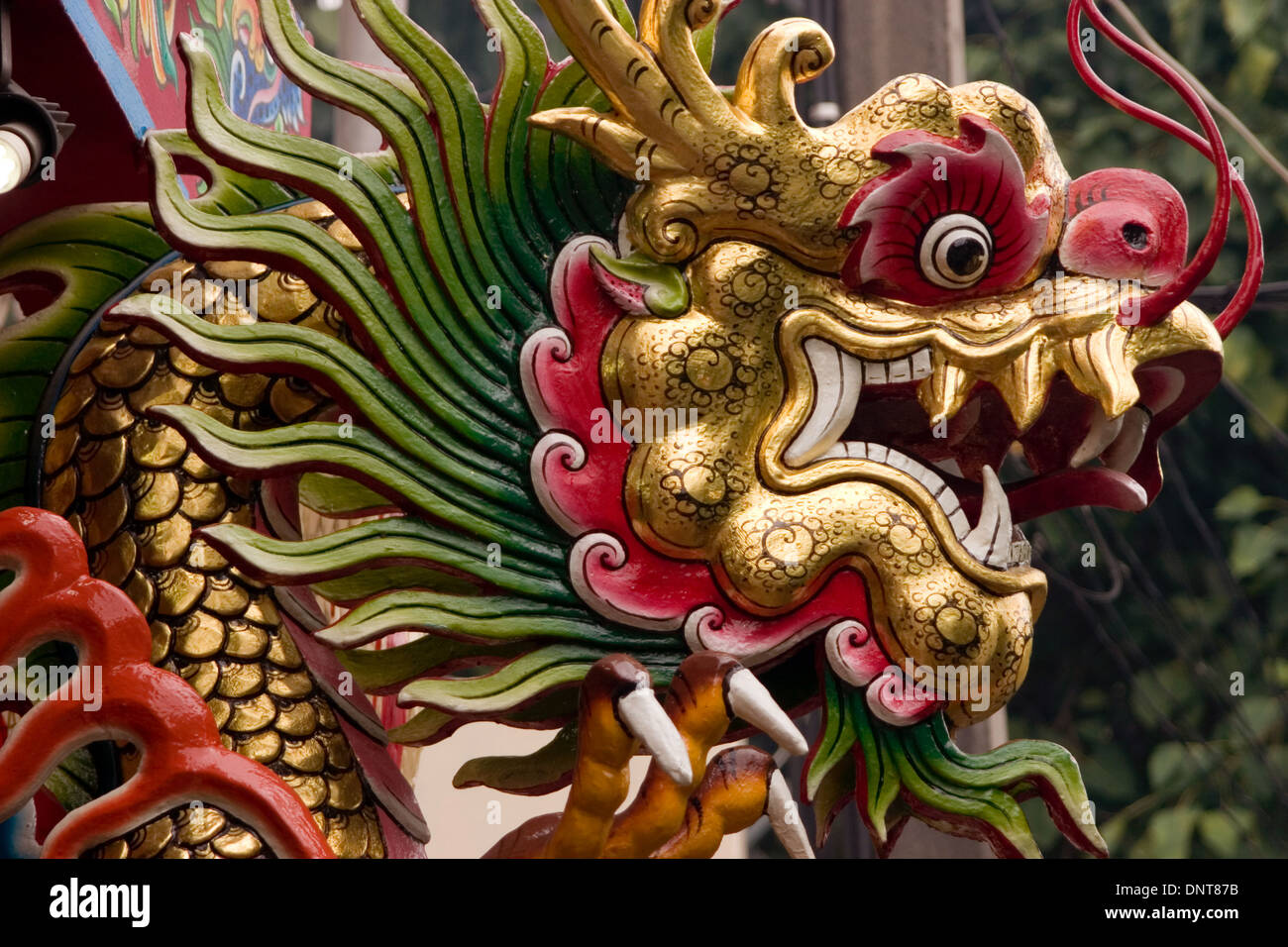 Horizontal art of a Chinese dragon at the entrance to a temple Stock Photo