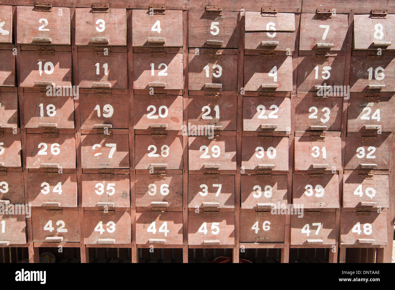 Numbered locker boxes outside the Kuthodaw Pagoda, containing the 729 stupas known as the world's biggest book. Stock Photo