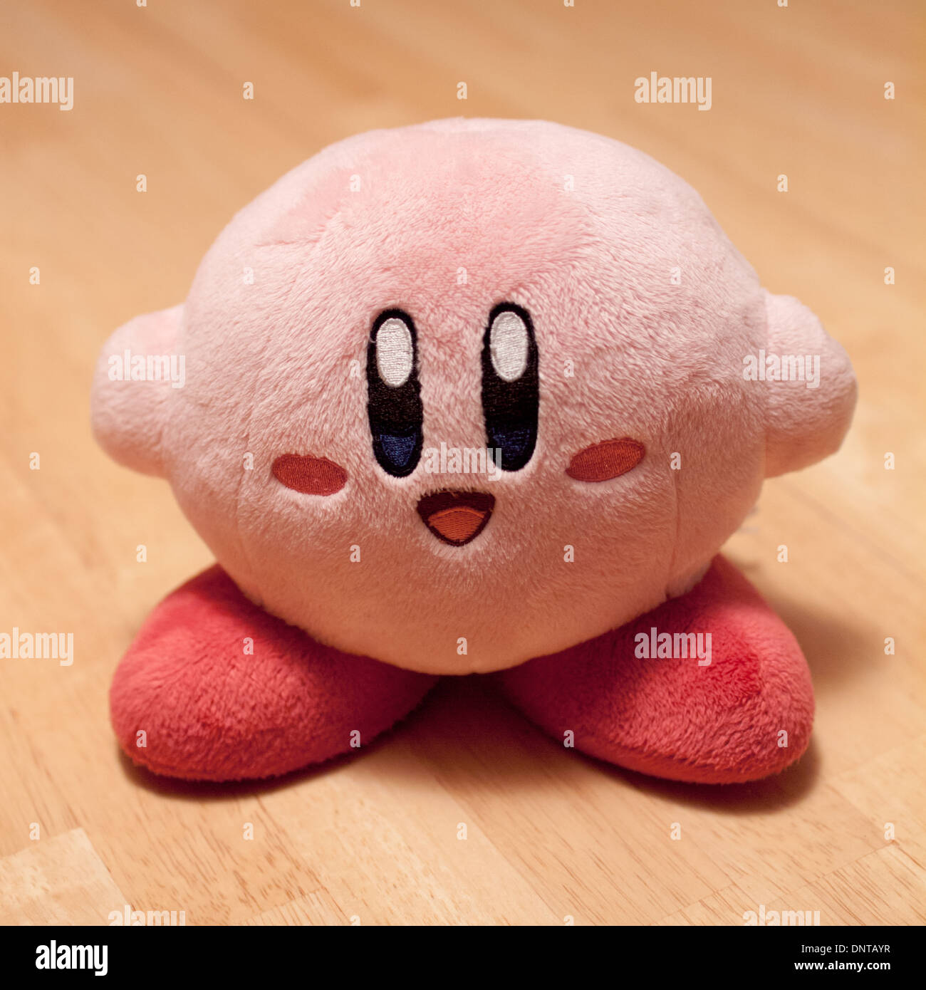 A plush Kirby. Kirby (カービ) is a fictional character in the Kirby video game series by HAL Laboratory and Nintendo. Stock Photo