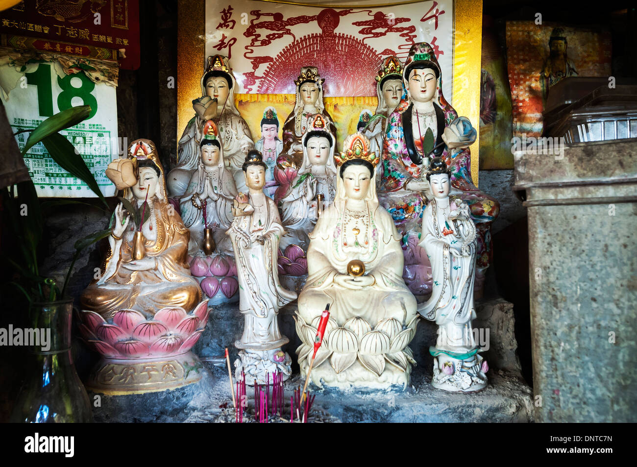 Statues of the Goddess of Mercy Guanyin in a makeshift shrine, Hong Kong Stock Photo