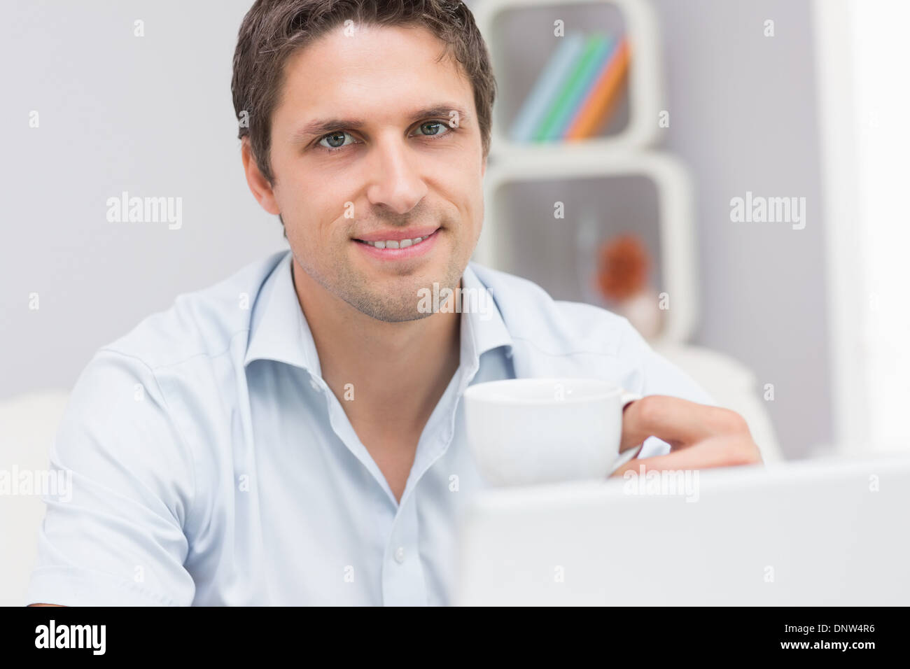 Man holding teacup hires stock photography and images Alamy