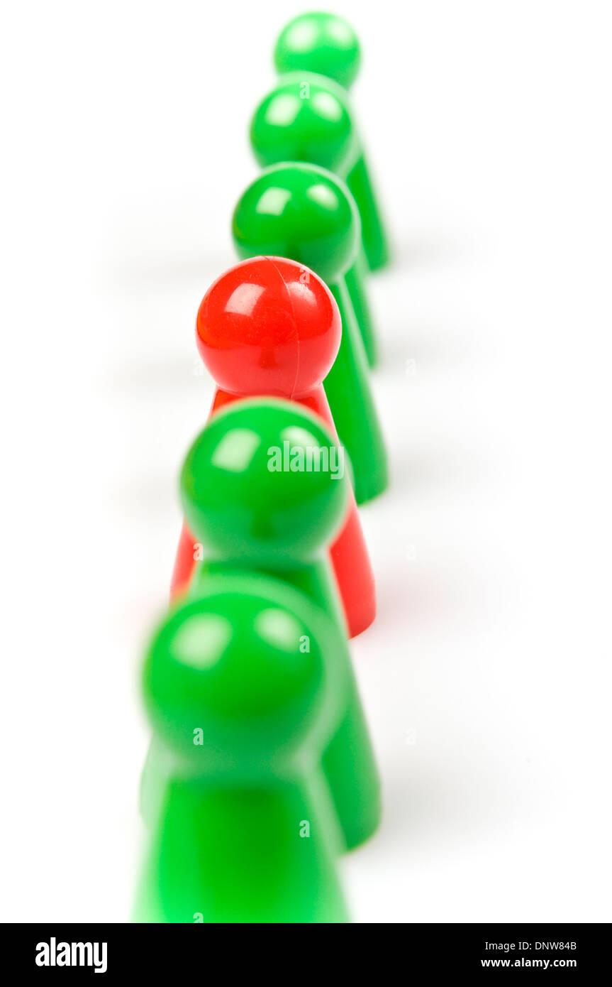 green plastic counters with one red Stock Photo