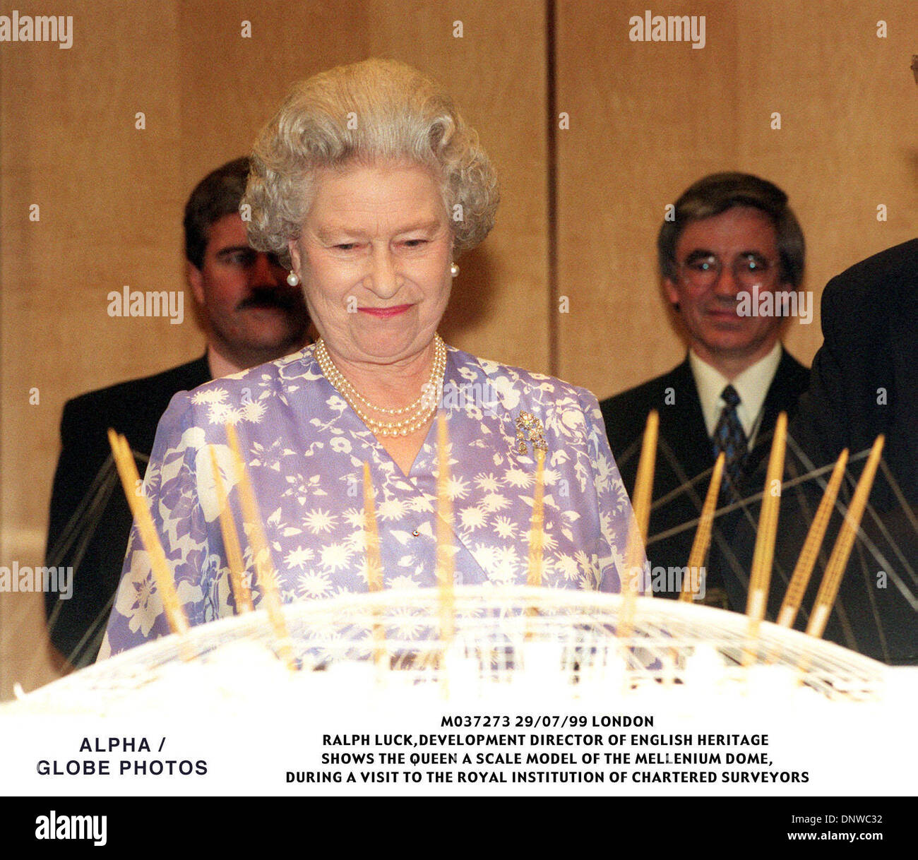 July 29, 1999 - London, Great Britain - The Queen admires a scale model of the Millennium Dome, during a visit Thursday 29th July, to the Royal Institution of Chartered Surveyors, in London.(Credit Image: © Globe Photos/ZUMAPRESS.com) Stock Photo