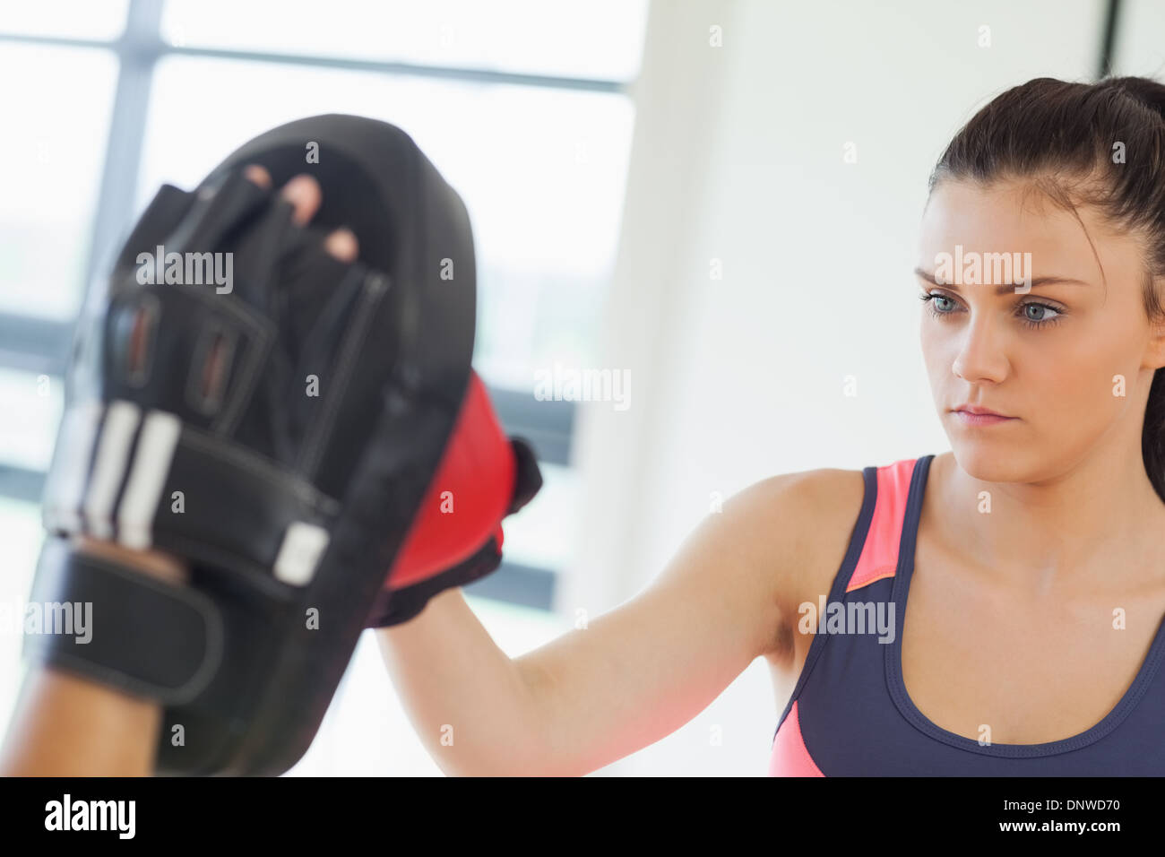 Determined female boxer focused on her training Stock Photo