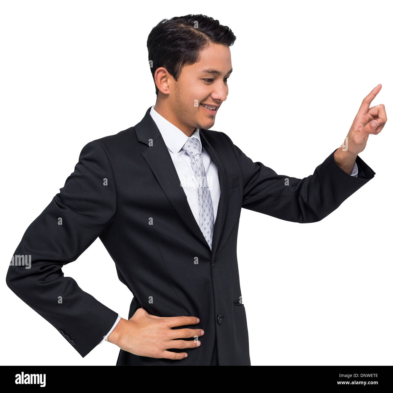 Smiling asian businessman pointing Stock Photo
