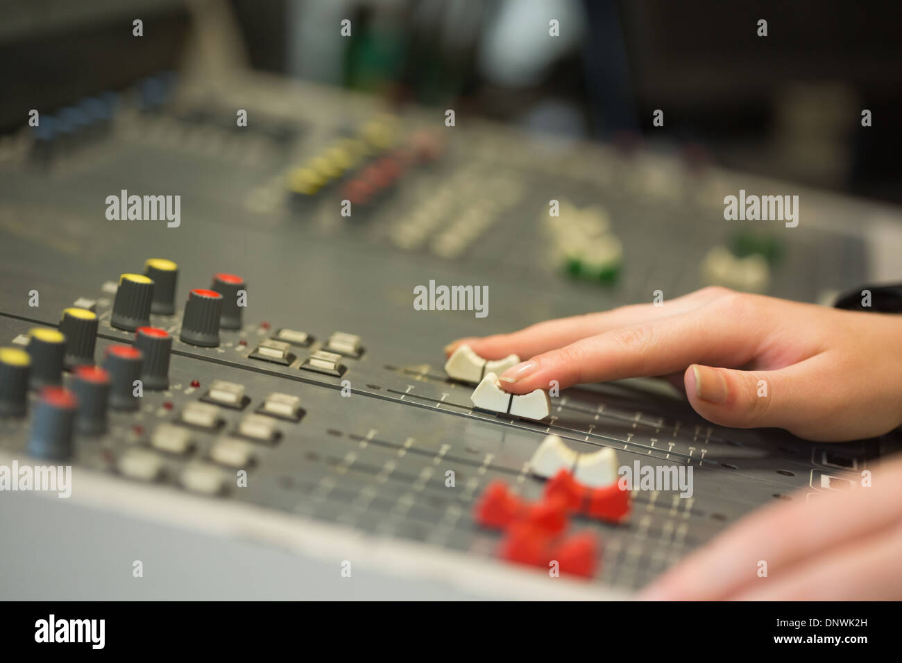 Student working on sound mixer Stock Photo - Alamy