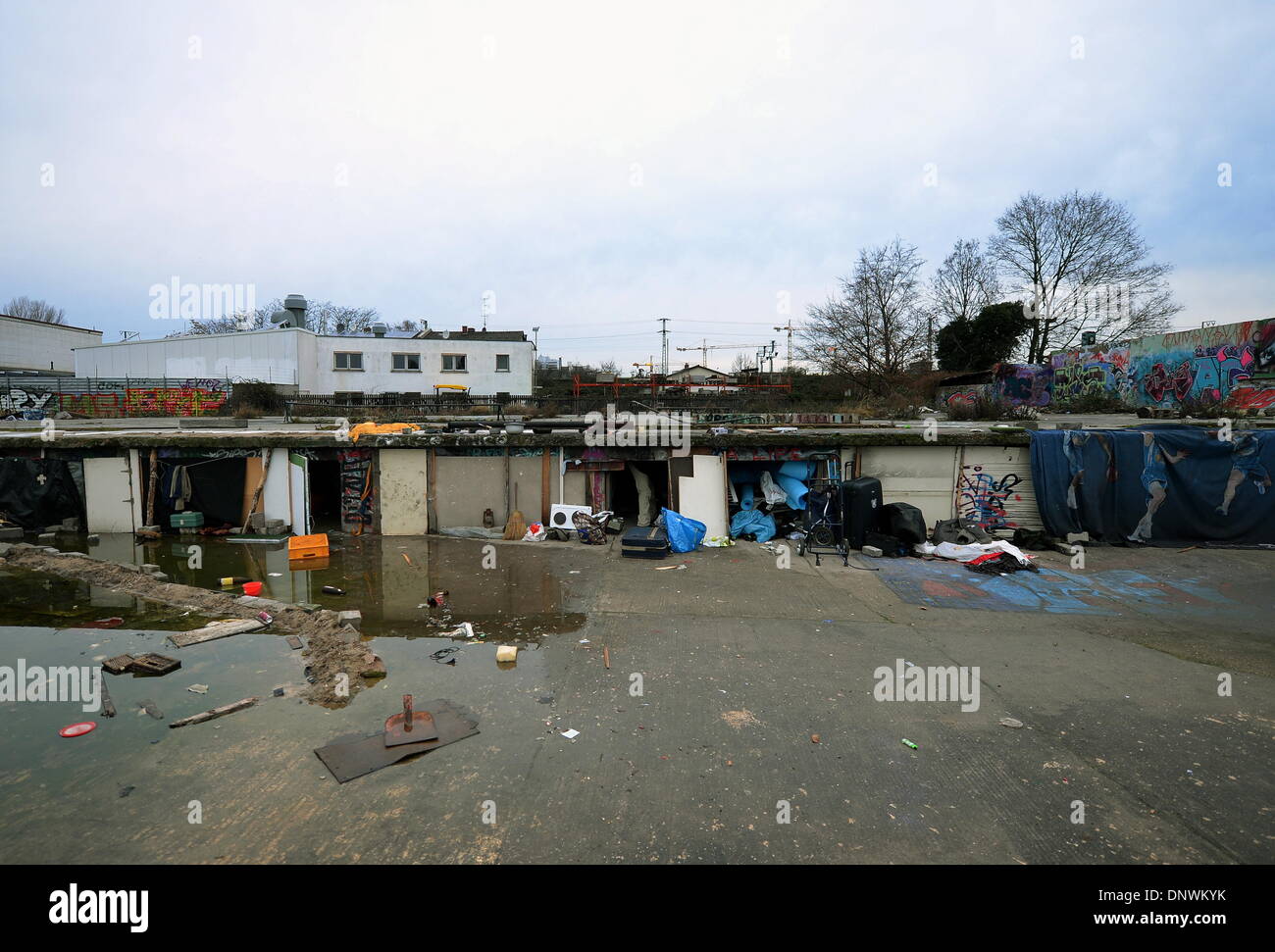 Frankfurt Main, Germany. 04th Jan, 2014. Homes of Romanian workers on the grounds of a former furniture removal company in Frankfurt Main, Germany, 04 January 2014. The Romanians earn their money with temporary jobs at construction sites, the sale of bulk waste on flea markets and with collecting bottles and scrap metal. They get warm meals and the possibility to take a shower at the diaconal institution. Photo: Andreas Arnold/dpa/Alamy Live News Stock Photo