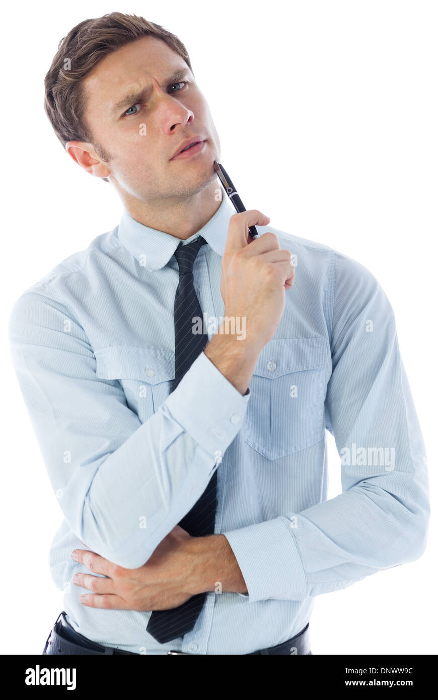 Thinking businessman holding pen Stock Photo