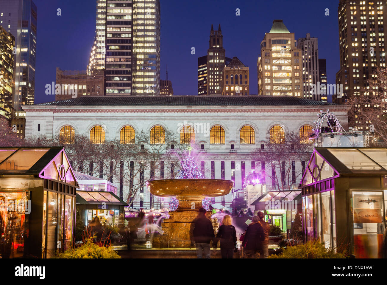 Winter Village and the Josephine Shaw Lowell Fountain, Bryant Park, behind New York Public Library, NYC. Stock Photo