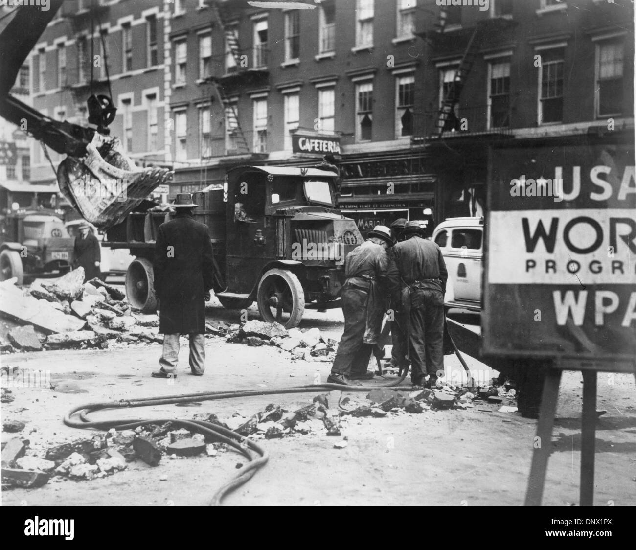 May 25, 1932 - New York, NY, U.S. - The Roosevelt administration created many jobs for the unemployed during the depression. The picture shows workers repairing New York street. (Credit Image: © KEYSTONE Pictures USA/ZUMAPRESS.com) Stock Photo