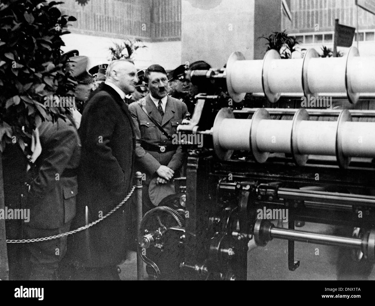 March 7, 1934 - Leipzig, Germany - Nazi leader and Fuhrer of Germany, ADOLF HITLER inspects a weaving machine at the Leipzig Fair in 1934. (Credit Image: © KEYSTONE Pictures USA/ZUMAPRESS.com) Stock Photo