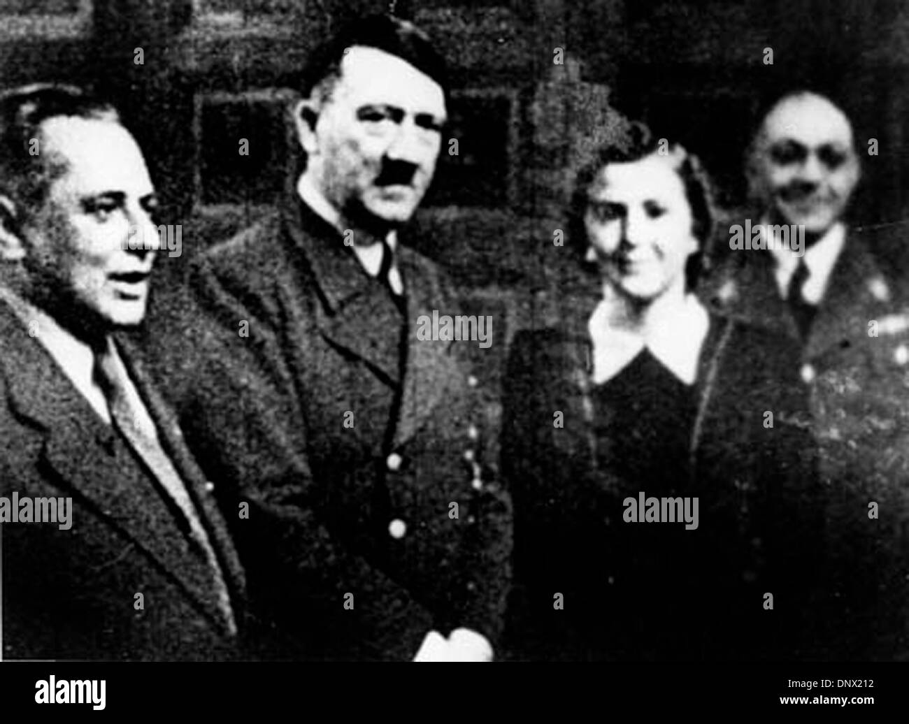 April 20, 1938 - Berlin, Germany - ADOLF HITLER at his birthday party with HEINRICH HOFFMAN, EVA BRAUN and PROF. MORELL. Adolf Hitler (April 20, 1889ÐApril 30, 1945) was the Fuhrer (Leader and Imperial chancellor) of Germany from 1933 to his death. He was leader of the National Socialist German Workers Party (NSDAP), better known as the Nazi Party. At the height of his power, the a Stock Photo