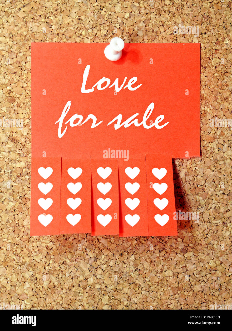 Red paper add with Love for sale text pinned to the corkboard Stock Photo